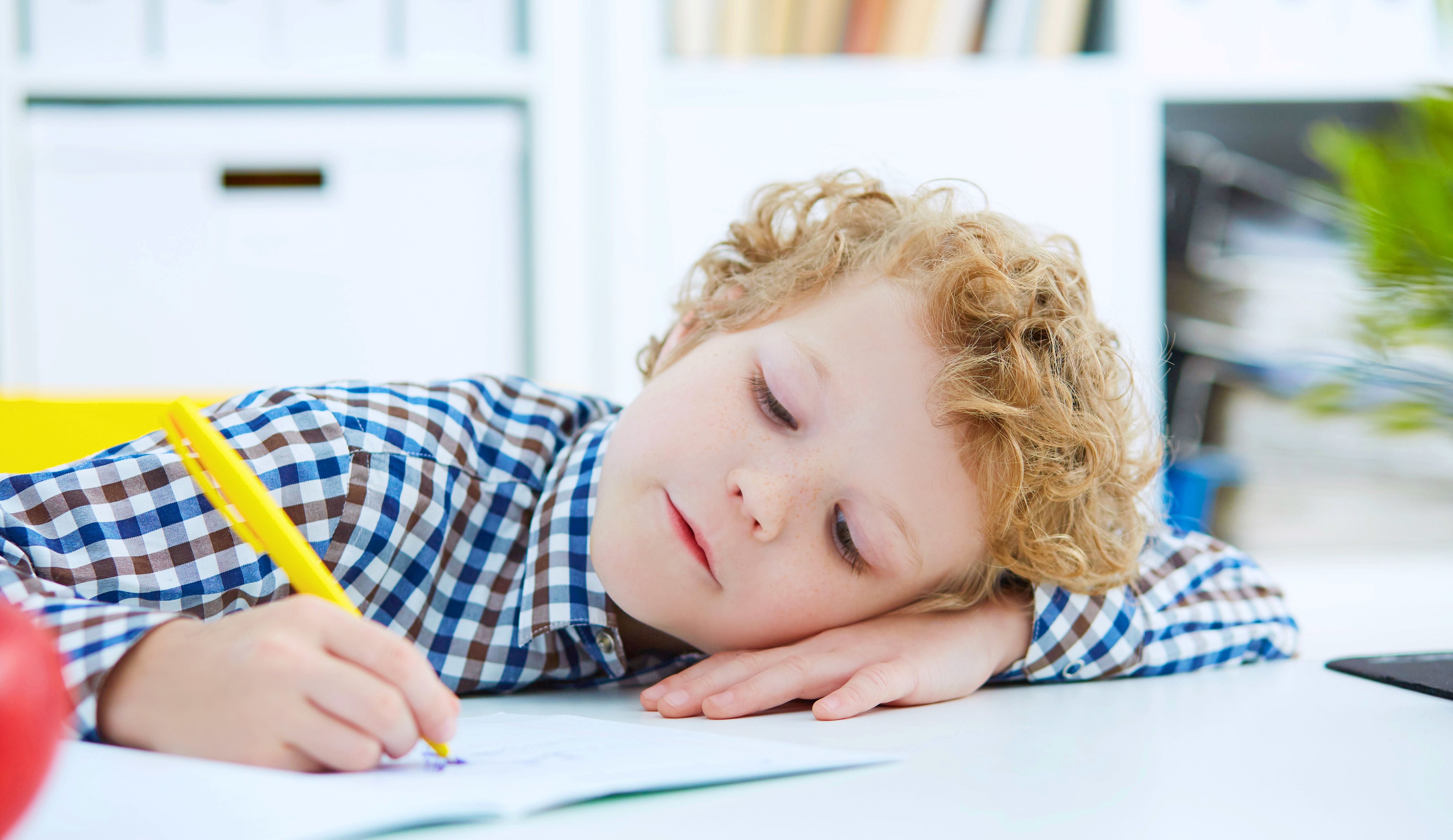 Boy writing at school