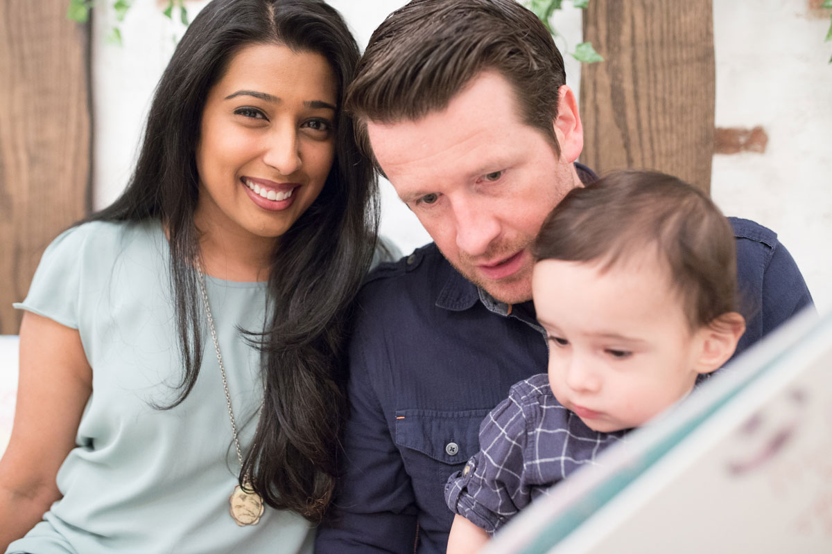 Rina P. Collins and Andy Collins with their child.